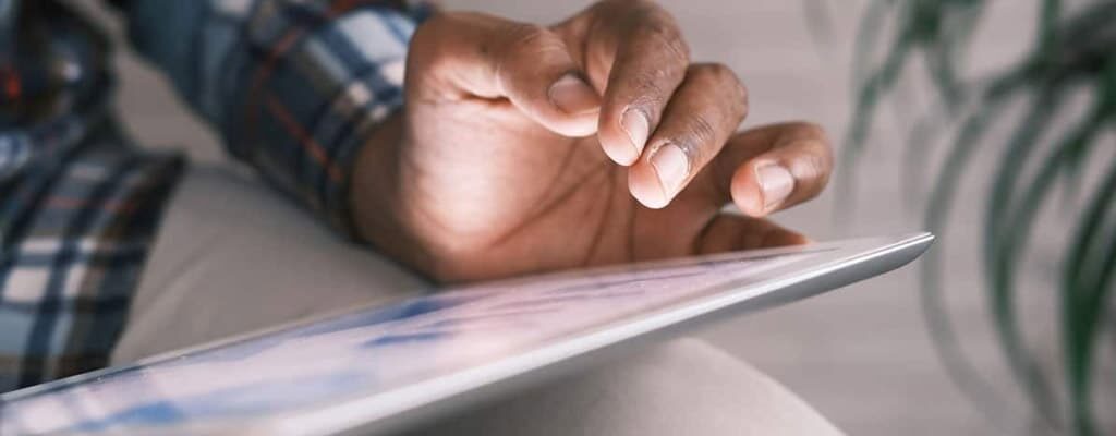 Man using a cloud based document management system on an iPad