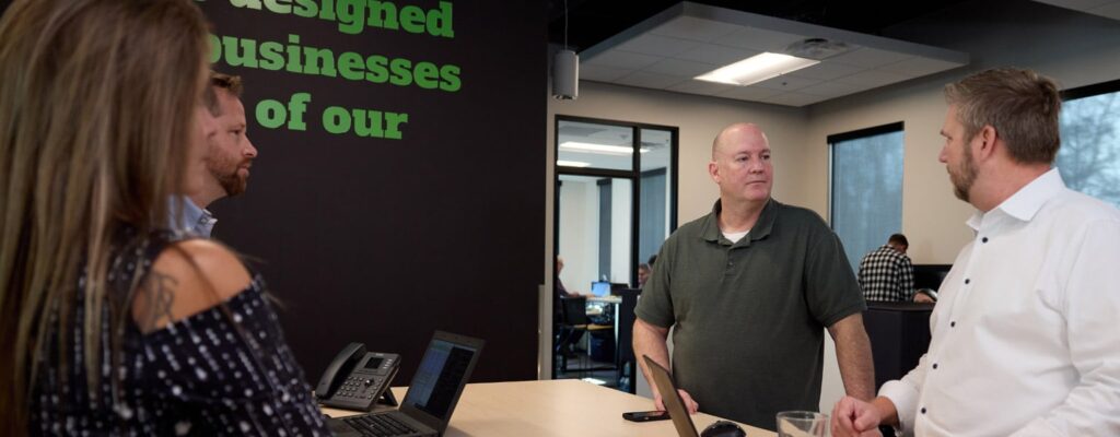 IT Asset Management being explained to three people