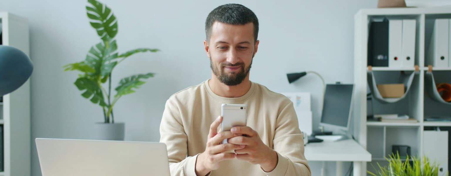 VoIP Call Features Man in an office on phone using VoIP call features